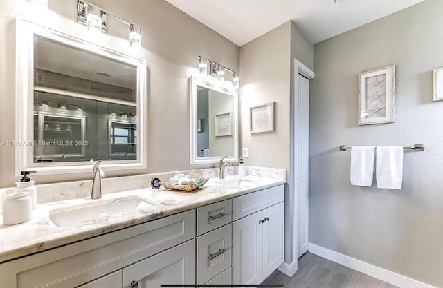 220 Kite Ave, Sebring, FL 33870 - full bathroom featuring double vanity, wood finished floors, and an enclosed shower