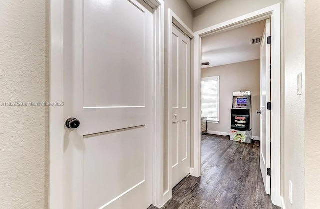 220 Kite Ave, Sebring, FL 33870 - corridor with dark wood finished floors and baseboards