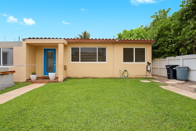 634 82nd St, Miami Beach, FL 33141 - view of front facade with stucco siding and a tiled roof