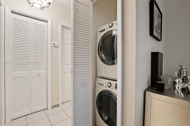 634 82nd St, Miami Beach, FL 33141 - laundry area featuring estacked washer and dryer and light tile patterned flooring