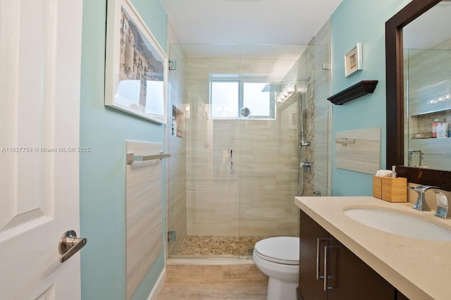 634 82nd St, Miami Beach, FL 33141 - bathroom with vanity, a shower stall, and wood finished floors