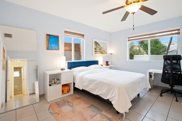 634 82nd St, Miami Beach, FL 33141 - bedroom featuring light tile patterned flooring, multiple windows, and a ceiling fan
