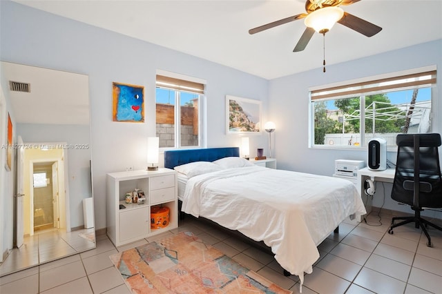 634 82nd St, Miami Beach, FL 33141 - bedroom with light tile patterned floors and a ceiling fan