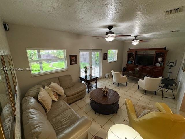 13736 SW 12th St, Miami, FL 33184 - living room with ceiling fan, light tile patterned floors, and a textured ceiling