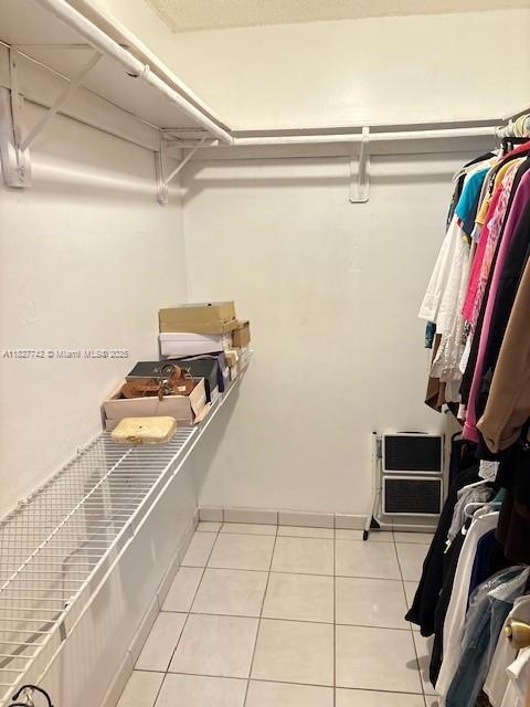 13736 SW 12th St, Miami, FL 33184 - walk in closet featuring light tile patterned floors