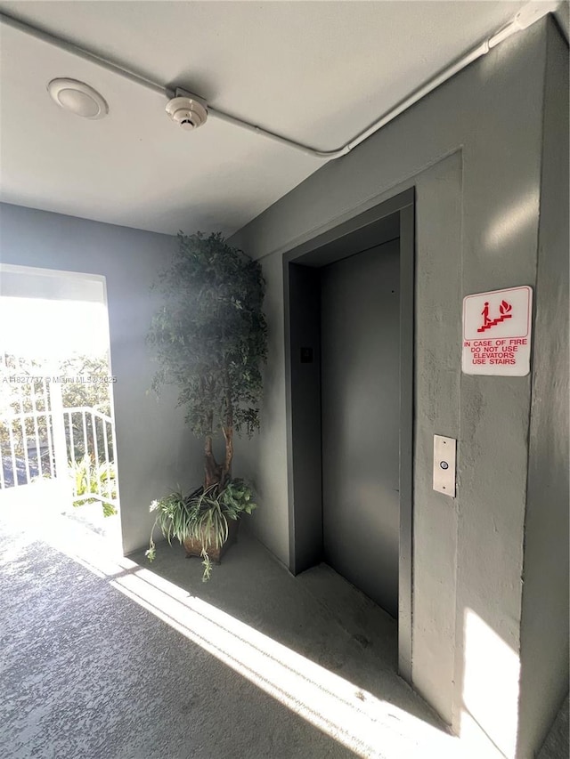 645 NE 121st St Unit 404, North Miami, FL 33161 - corridor with carpet and elevator