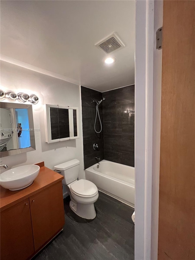 645 NE 121st St Unit 404, North Miami, FL 33161 - bathroom with vanity, wood finished floors, and bathing tub / shower combination