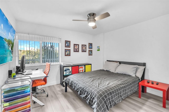 9525 Weldon Cir Unit H305, Tamarac, FL 33321 - bedroom with wood finished floors, an office area, and a ceiling fan