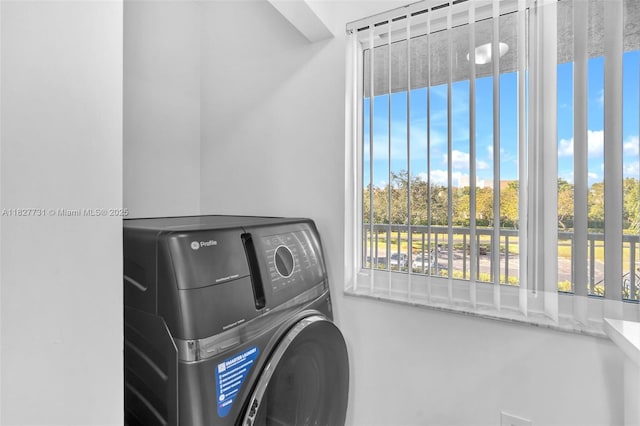 9525 Weldon Cir Unit H305, Tamarac, FL 33321 - washroom featuring washer / dryer and healthy amount of natural light