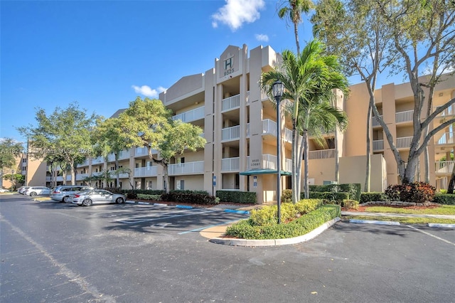 9525 Weldon Cir Unit H305, Tamarac, FL 33321 - view of apartment building / complex with uncovered parking