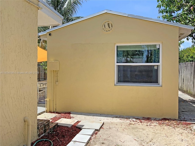 2714 Fillmore St, Hollywood, FL 33020 - view of side of home featuring stucco siding and a patio