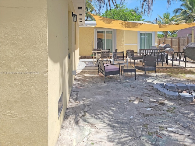2714 Fillmore St, Hollywood, FL 33020 - view of patio / terrace with grilling area and an outdoor living space with a fire pit
