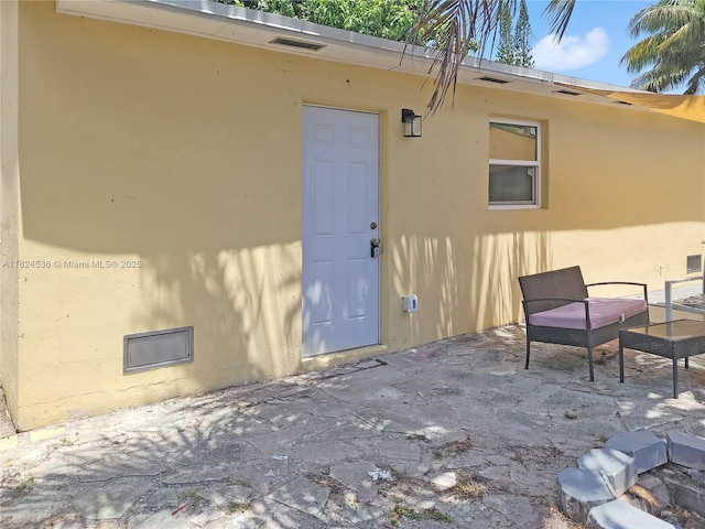 2714 Fillmore St, Hollywood, FL 33020 - entrance to property with a patio area and stucco siding