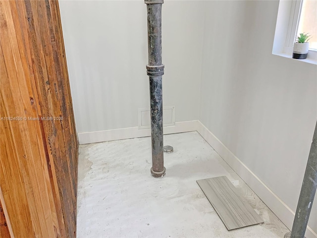 2714 Fillmore St, Hollywood, FL 33020 - detailed view of unfinished concrete flooring and baseboards