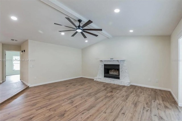 6065Waycross Drive, Spring Hill, FL 34606 - unfurnished living room featuring wood finished floors, recessed lighting, a stone fireplace, and a ceiling fan