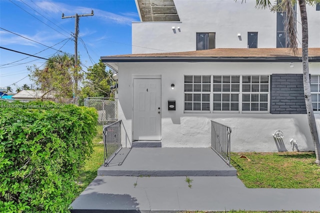 750 84th St, Miami Beach, FL 33141 - entrance to property featuring stucco siding and a gate