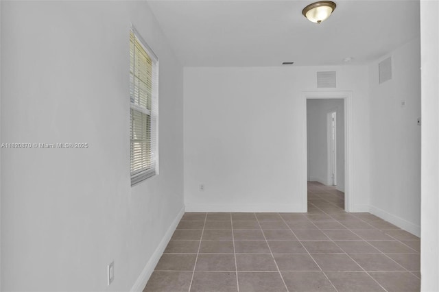 750 84th St, Miami Beach, FL 33141 - tiled empty room featuring baseboards