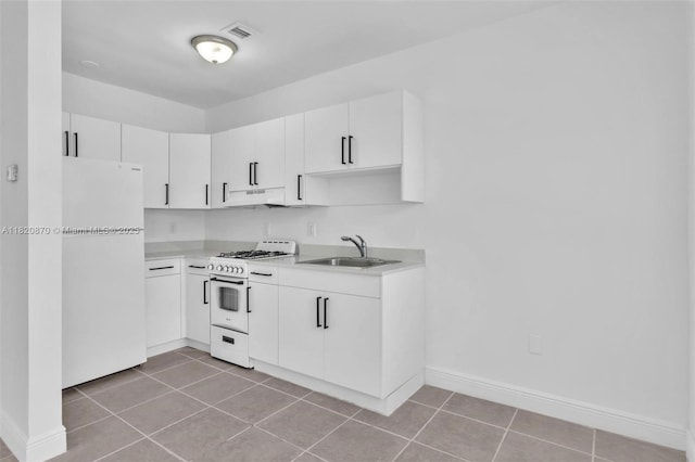 750 84th St, Miami Beach, FL 33141 - kitchen with white appliances, light countertops, under cabinet range hood, and white cabinetry