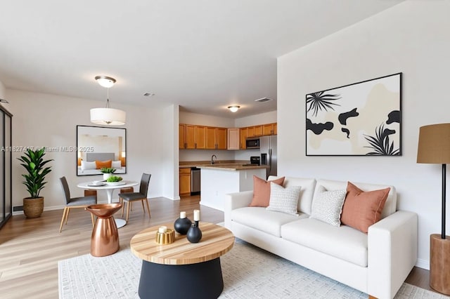 2872 SW 127th Way Unit 1, Miramar, FL 33027 - living room featuring light wood-style flooring