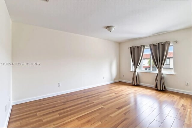 2872 SW 127th Way Unit 1, Miramar, FL 33027 - unfurnished room with light wood-style floors and baseboards