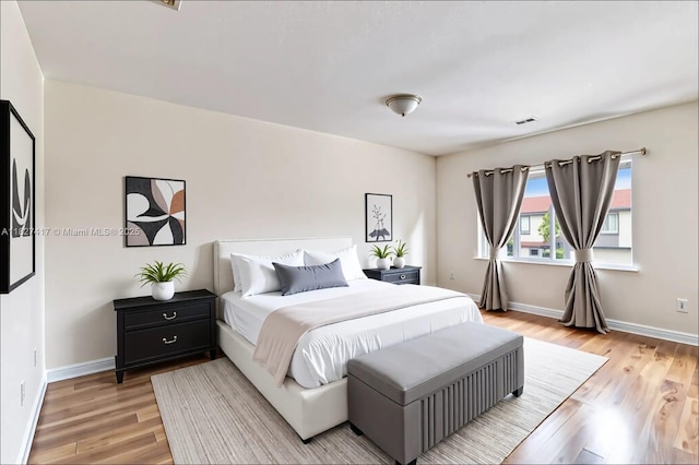 2872 SW 127th Way Unit 1, Miramar, FL 33027 - bedroom with light wood-type flooring and baseboards
