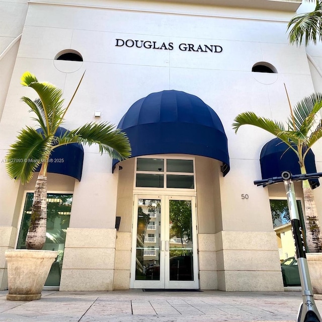 50 Menores Ave Unit 711, Coral Gables, FL 33134 - property entrance featuring french doors and stucco siding