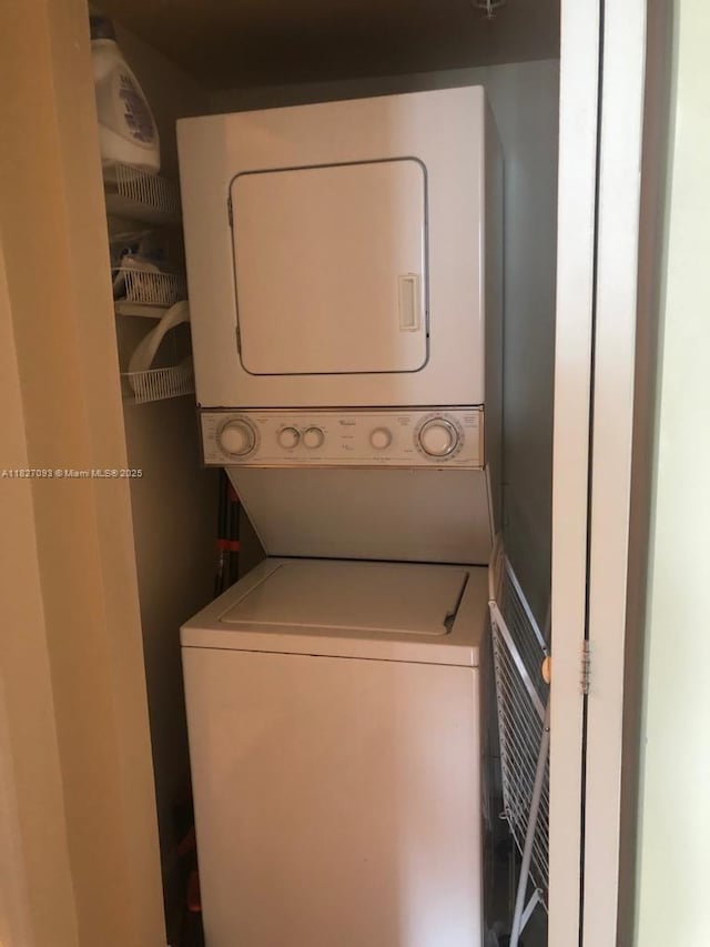 50 Menores Ave Unit 711, Coral Gables, FL 33134 - laundry room featuring stacked washer / dryer