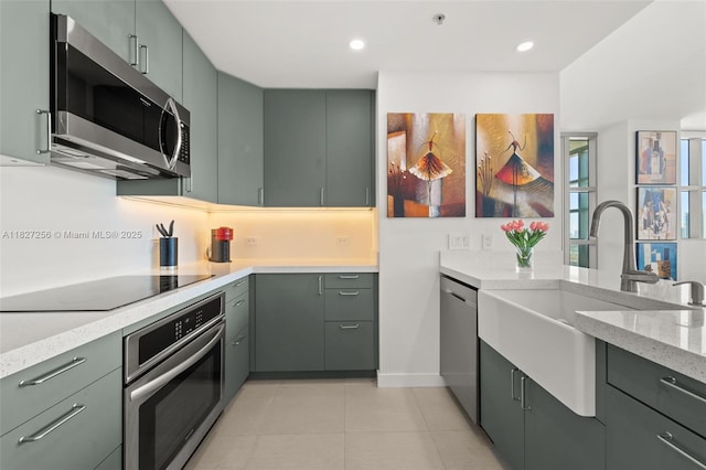3301 NE 1st Ave Unit H2412, Miami, FL 33137 - kitchen with appliances with stainless steel finishes, light stone counters, light tile patterned flooring, and recessed lighting