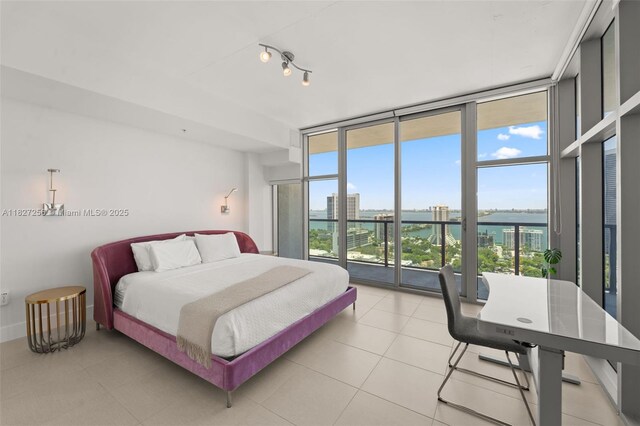 3301 NE 1st Ave Unit H2412, Miami, FL 33137 - bedroom featuring expansive windows, multiple windows, access to outside, a water view, and light tile patterned floors