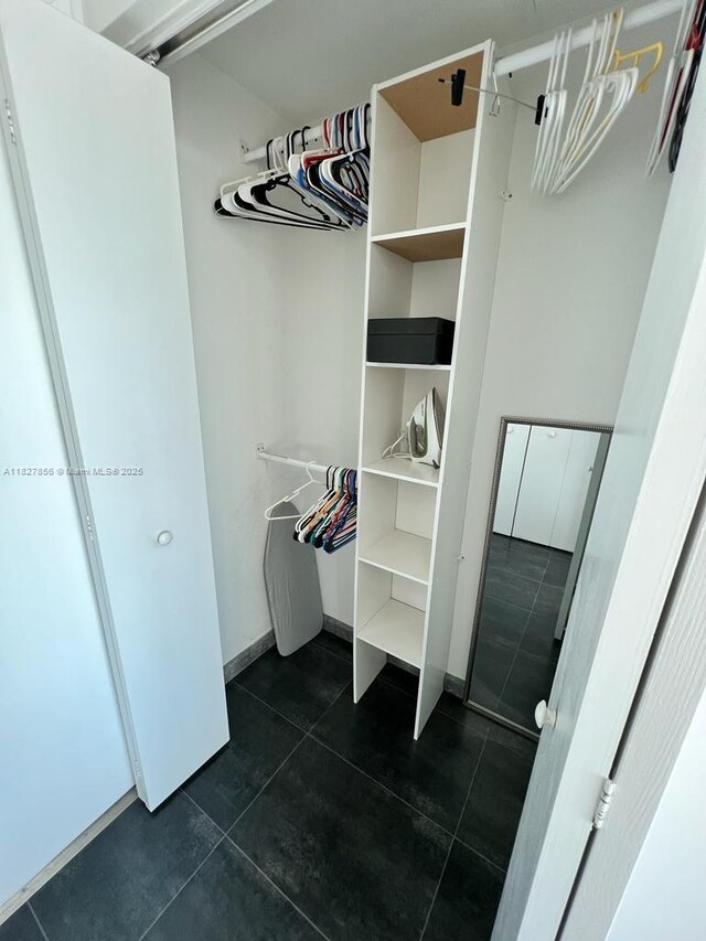 60 SW 13th St Unit 3407, Miami, FL 33130 - walk in closet with dark tile patterned flooring