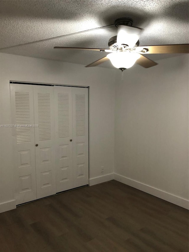 850 SW 133rd Ter Unit 302B, Pembroke Pines, FL 33027 - unfurnished bedroom with dark wood finished floors, a closet, ceiling fan, and a textured ceiling