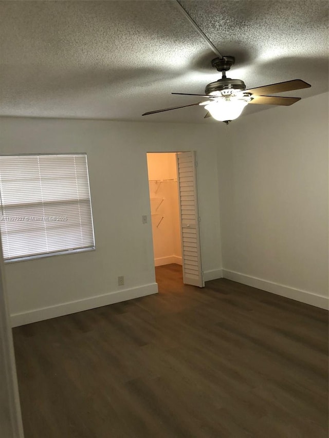 850 SW 133rd Ter Unit 302B, Pembroke Pines, FL 33027 - unfurnished room featuring a ceiling fan, a textured ceiling, and dark wood-type flooring