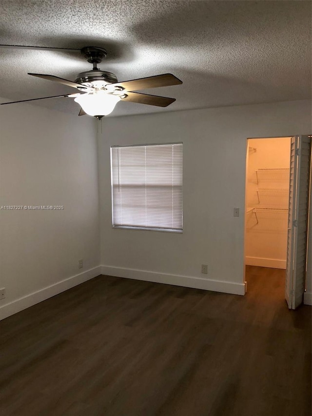 850 SW 133rd Ter Unit 302B, Pembroke Pines, FL 33027 - unfurnished room with a ceiling fan, a textured ceiling, and dark wood finished floors