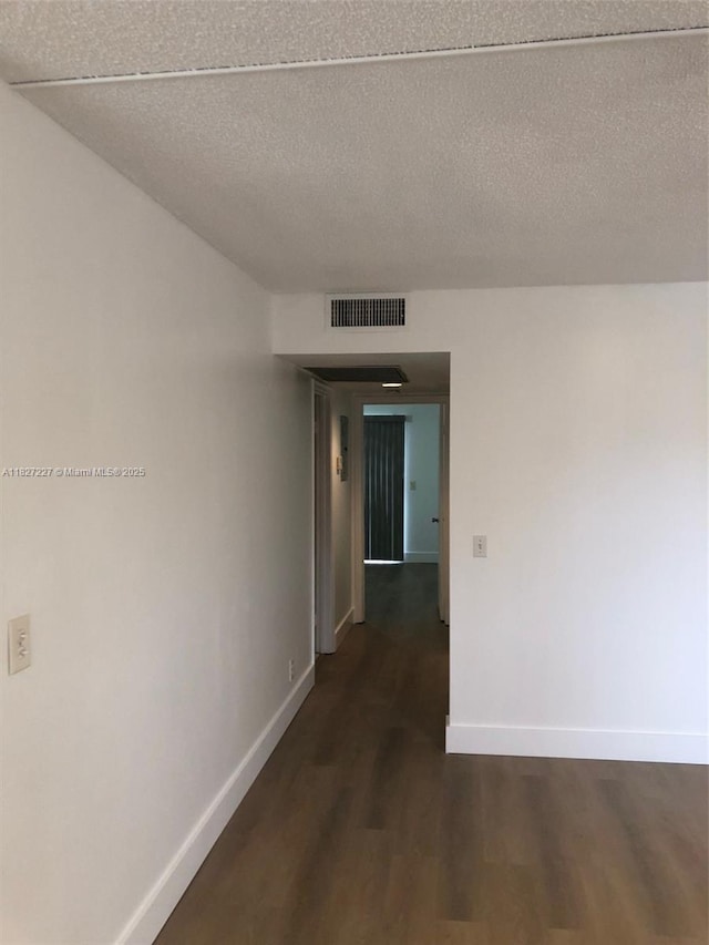 850 SW 133rd Ter Unit 302B, Pembroke Pines, FL 33027 - hall with dark wood-style floors and a textured ceiling