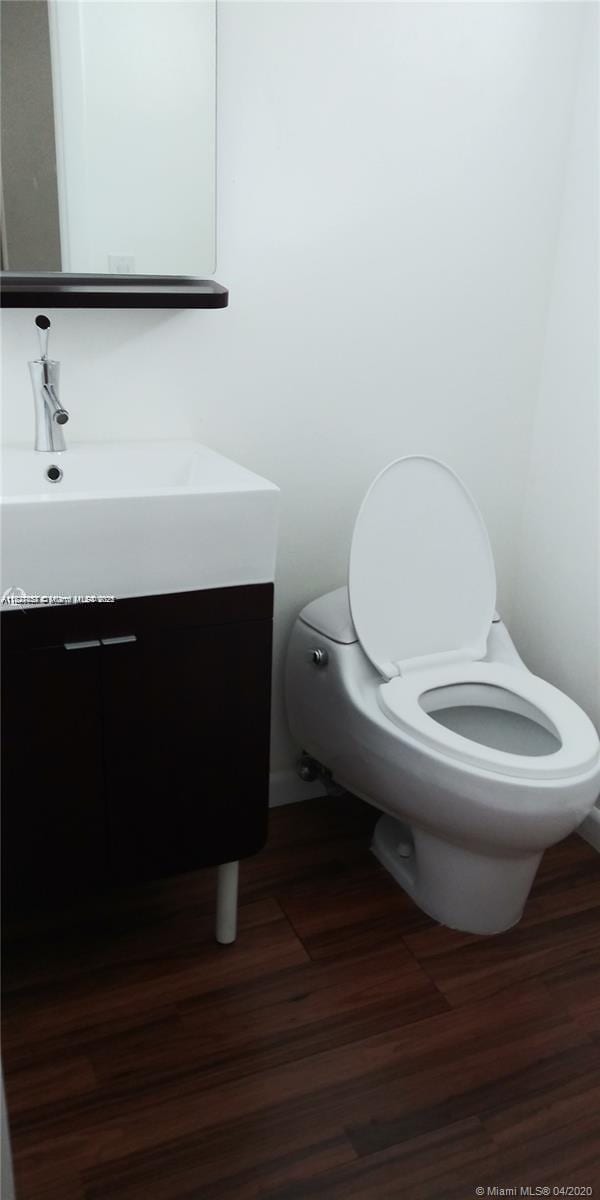1235 Mariposa Ave Unit 8, Coral Gables, FL 33146 - bathroom with vanity and wood finished floors