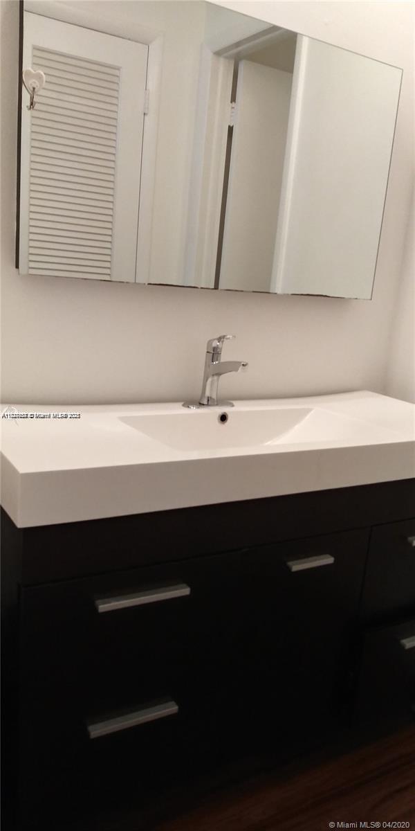 1235 Mariposa Ave Unit 8, Coral Gables, FL 33146 - bathroom with vanity