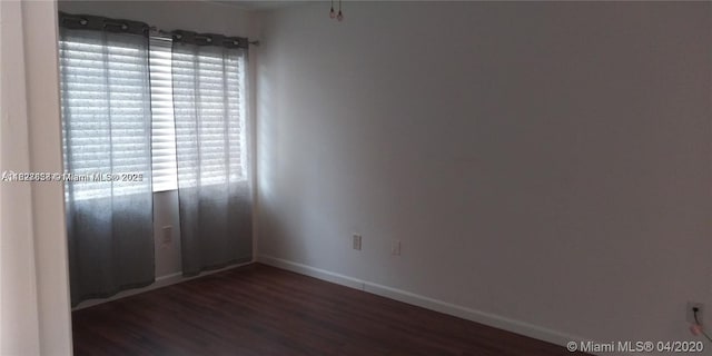 1235 Mariposa Ave Unit 8, Coral Gables, FL 33146 - empty room featuring wood finished floors and healthy amount of natural light