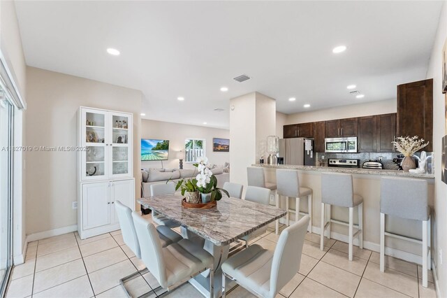 371 NE 32nd Ter, Homestead, FL 33033 - dining room with light tile patterned floors and recessed lighting