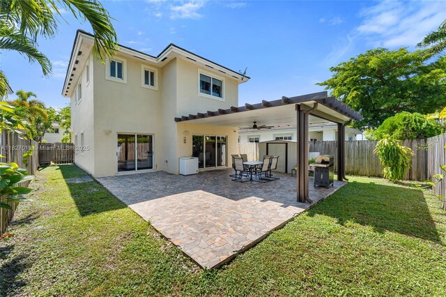 371 NE 32nd Ter, Homestead, FL 33033 - rear view of property with stucco siding, ceiling fan, a fenced backyard, and a patio area
