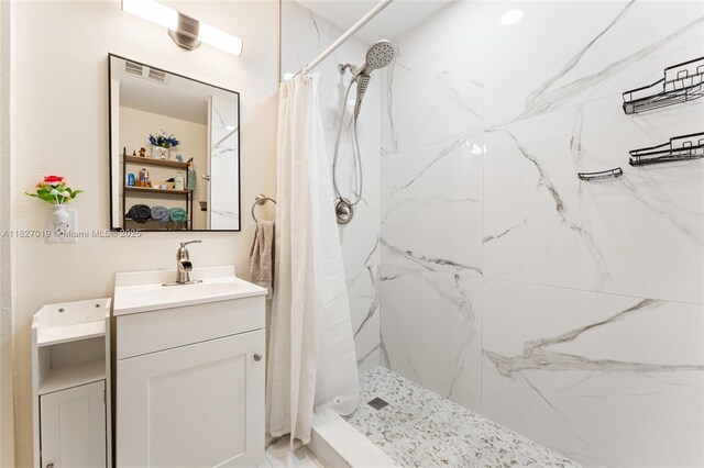 371 NE 32nd Ter, Homestead, FL 33033 - bathroom with vanity and a marble finish shower