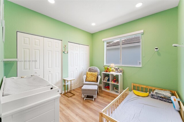 371 NE 32nd Ter, Homestead, FL 33033 - bedroom featuring multiple closets, light wood-type flooring, and recessed lighting