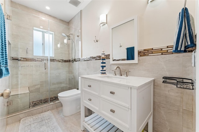 371 NE 32nd Ter, Homestead, FL 33033 - bathroom with tile walls, vanity, and a stall shower