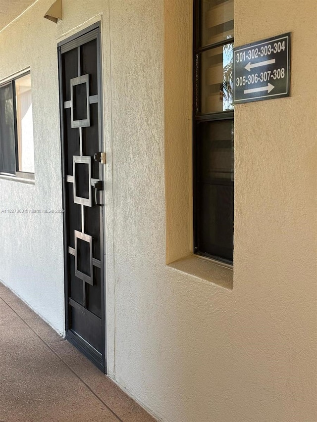 7310 Ashford Pl Unit 304, Delray Beach, FL 33446 - property entrance featuring stucco siding
