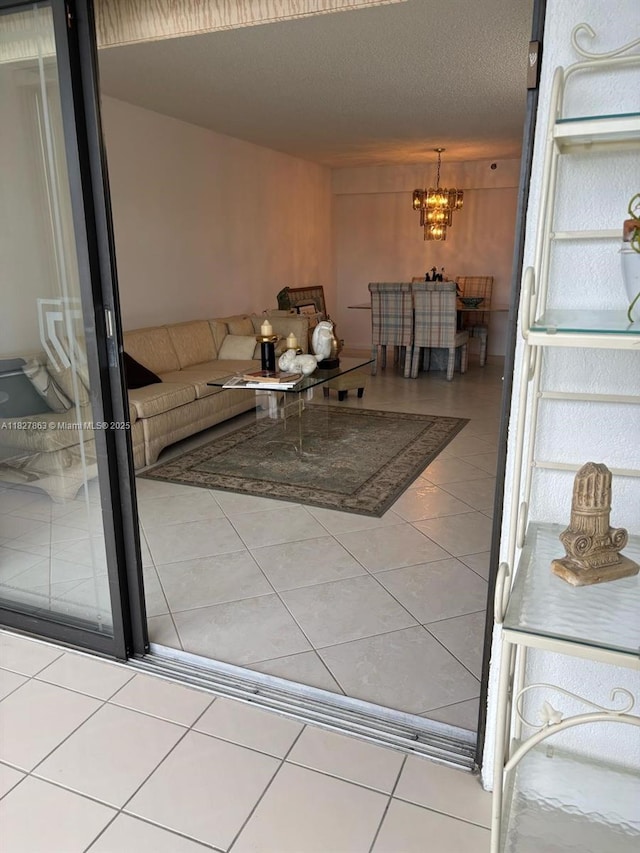 7310 Ashford Pl Unit 304, Delray Beach, FL 33446 - tiled living room featuring a chandelier