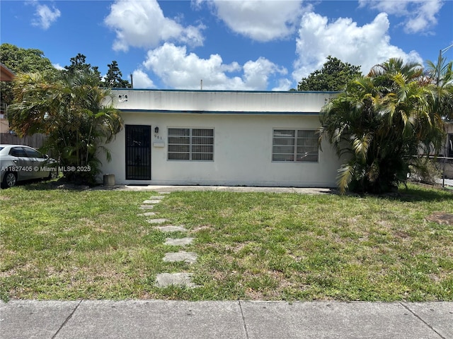981 E 18th St, Hialeah, FL 33013 - view of front of house featuring a front yard and stucco siding