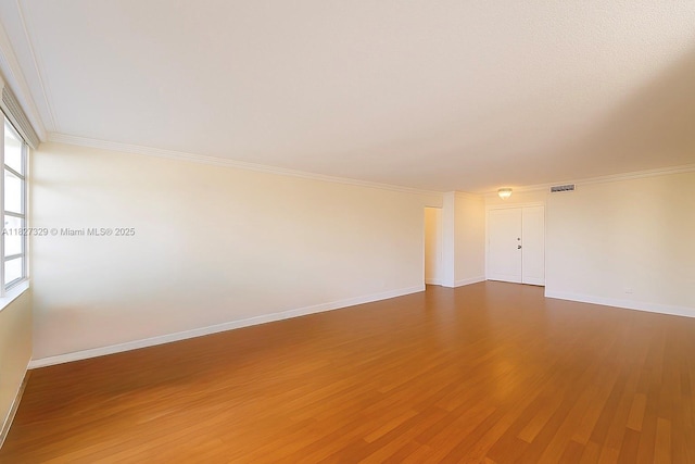 251 174th St Unit 115, Sunny Isles Beach, FL 33160 - empty room with wood finished floors and crown molding