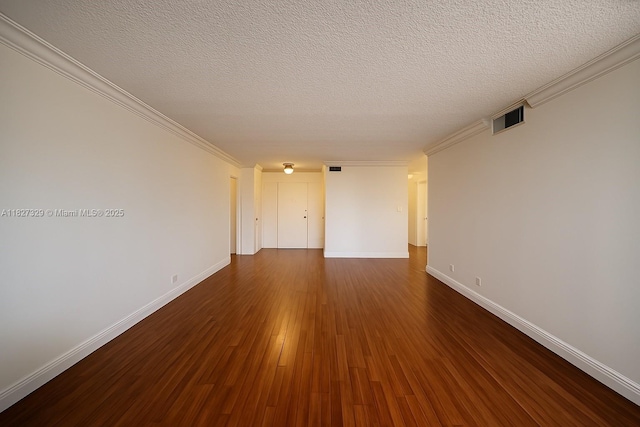 251 174th St Unit 115, Sunny Isles Beach, FL 33160 - empty room featuring dark wood finished floors, a textured ceiling, and ornamental molding