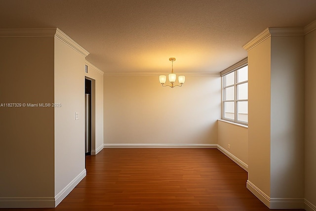 251 174th St Unit 115, Sunny Isles Beach, FL 33160 - spare room with a chandelier, dark wood finished floors, and a textured ceiling
