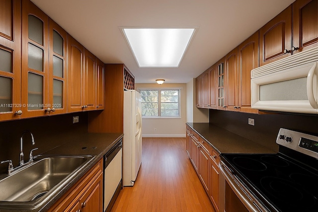 251 174th St Unit 115, Sunny Isles Beach, FL 33160 - kitchen with white appliances and brown cabinets
