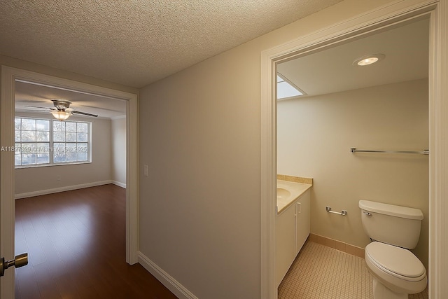 251 174th St Unit 115, Sunny Isles Beach, FL 33160 - half bath with vanity, ceiling fan, and wood finished floors